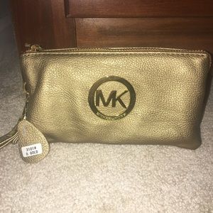 Brand new gold Michael Kors leather wristlet
